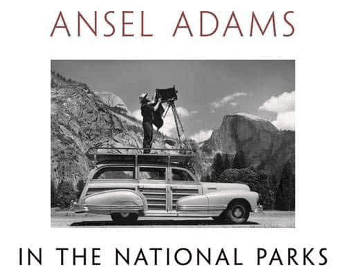 Photo of Ansel Adams with a camera on top of a vehicle (Bookcover for Ansel Adams in the National Parks"