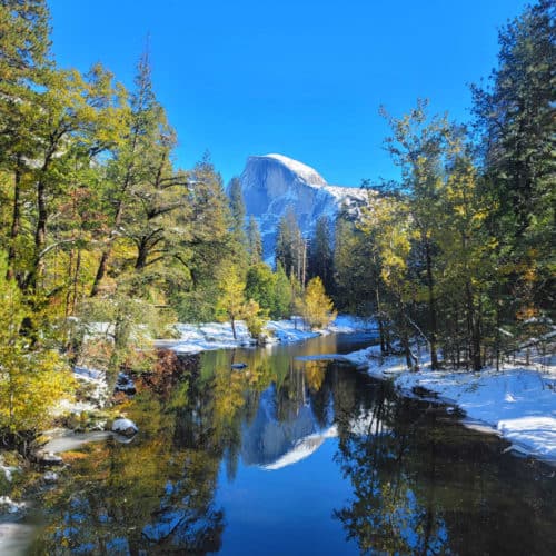 Half Dome and Merced River with snow at Yosemite National Park in the Winter