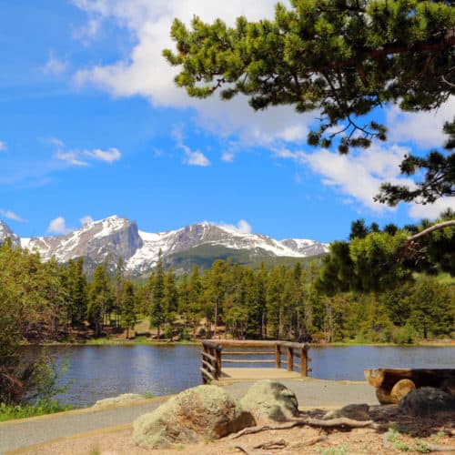 Sprague Lake surrounded by snow capped Rocky Mountains in Rocky Mountain National Park