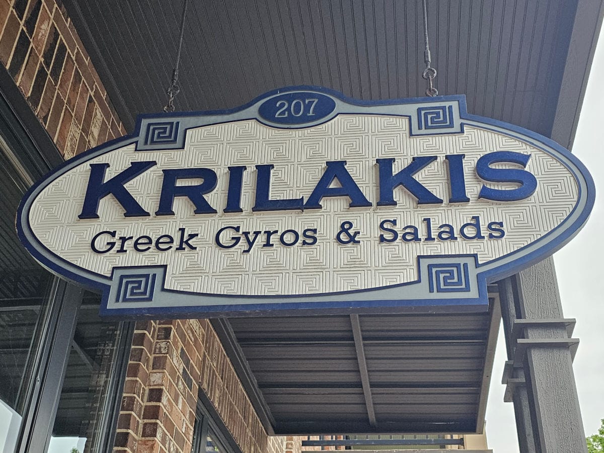 Krilakis Greek Gyros and Salads blue and white sign