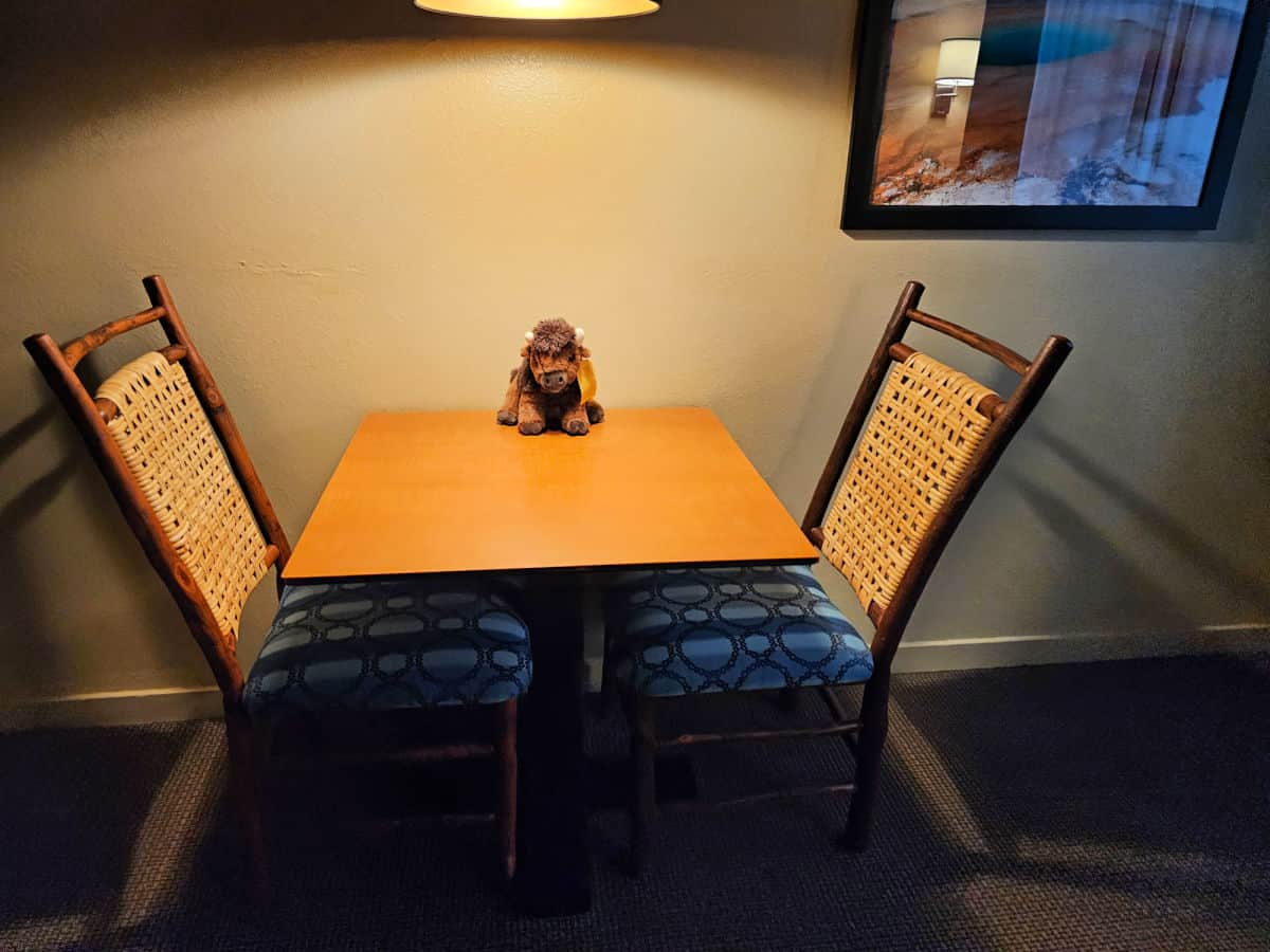 Table and chairs in Deluxe two Double Bed Lodge Room at Grant Village Lodge in Yellowstone National Park