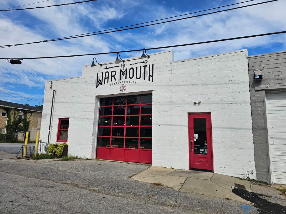 The War Mouth painted over the bright red entrance door