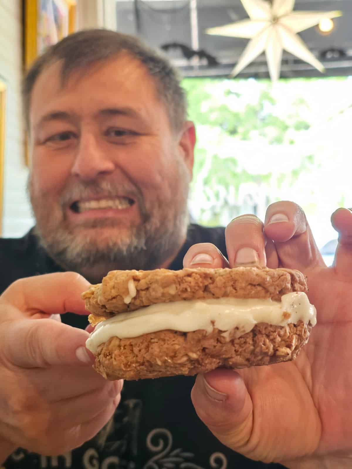 John holding an oatmeal cream pie