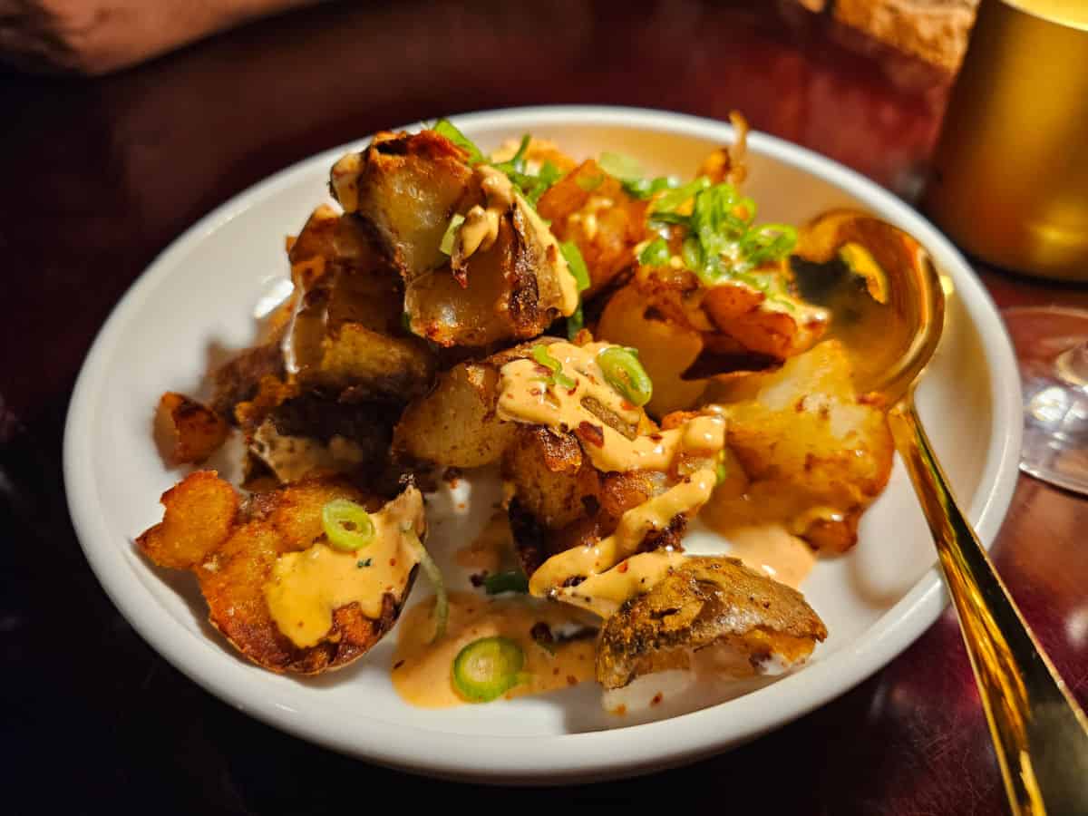 Patatas Bravas fried potatoes in a white bowl