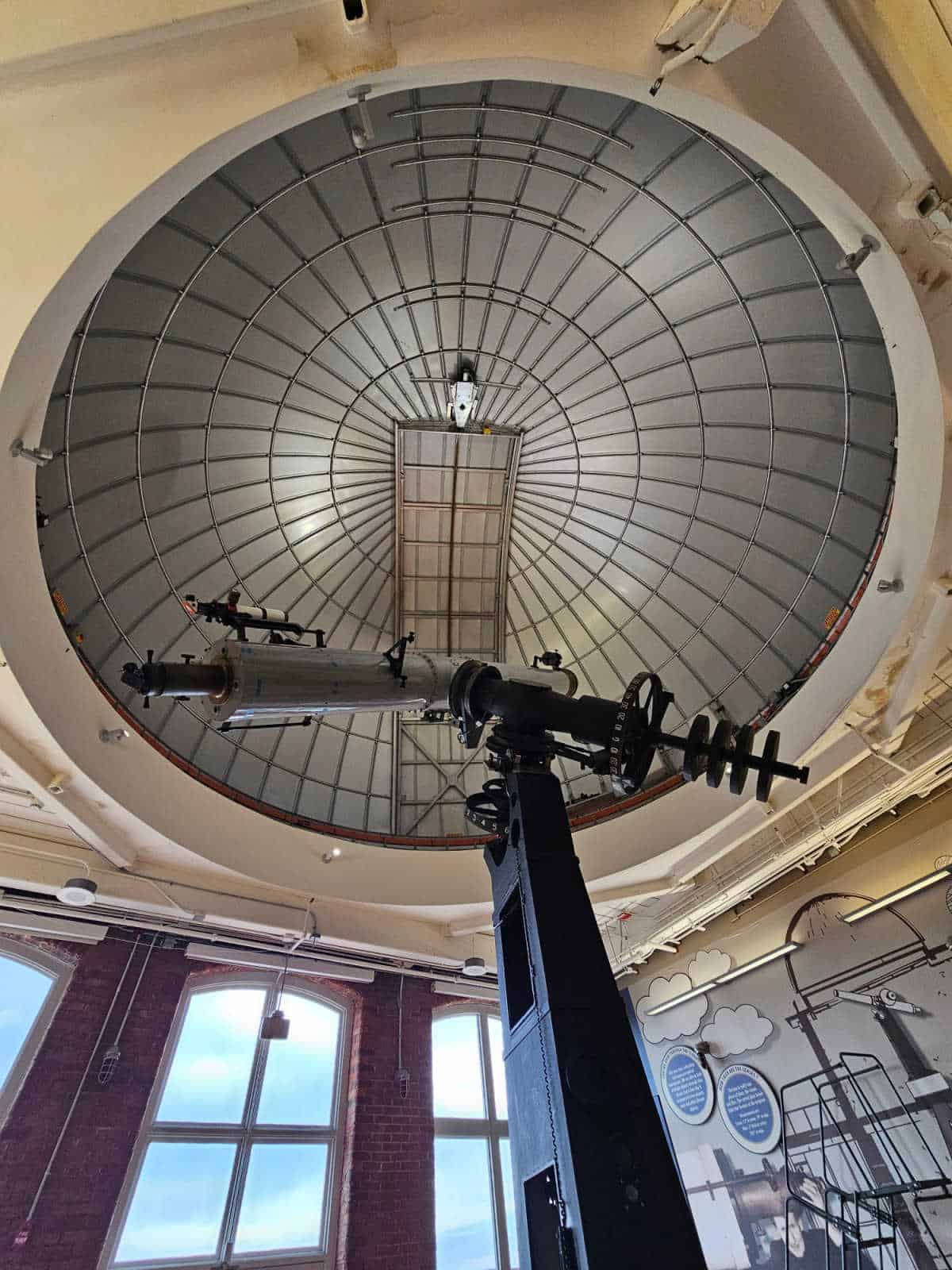 Solar telescope in a viewing area with windows nearby