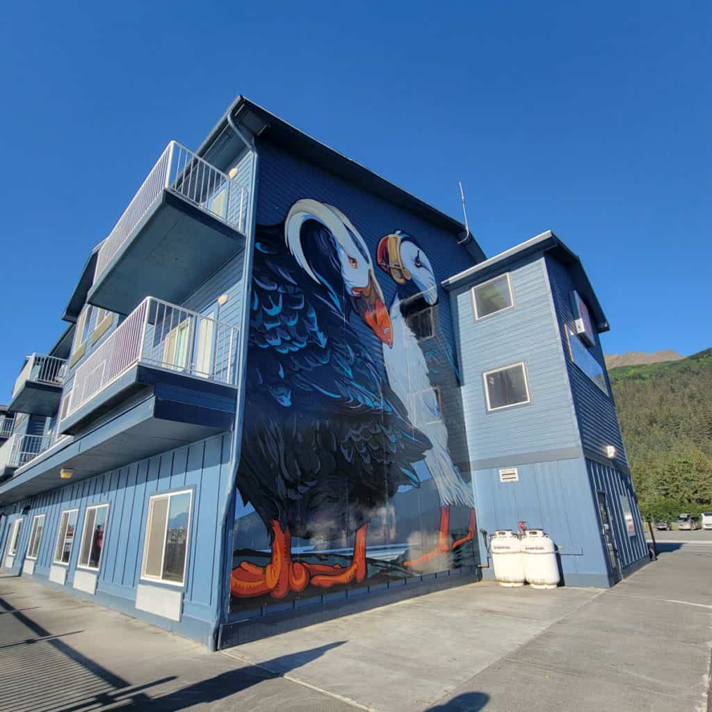 Harbor 360 Hotel in Seward Alaska with Puffins painted on the side of the building