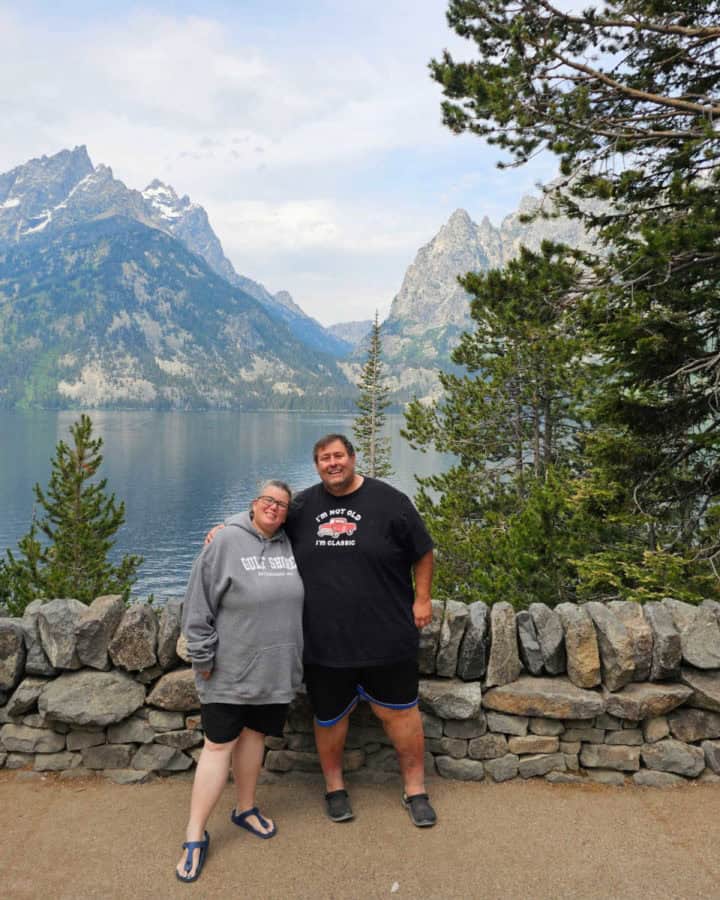 John and Tammilee standing in front of Jenny Lake in Grand Teton National Park, Wyoming